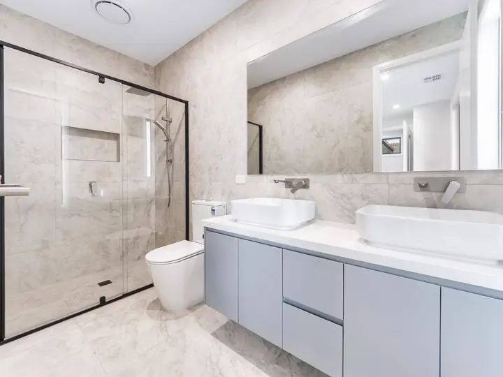 Ensuite with a double vanity and frameless shower, in the Aspen 25, built by Oakview at Oak Grove, Clyde North
