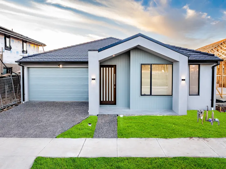 Gable facade with a double garage and timber slat door, in the Aspen 25, built by Oakview at Oak Grove, Clyde North