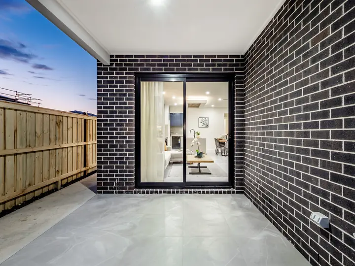 Alfresco with sliding doors to the living room, in a family home Oakview built in Clyde North