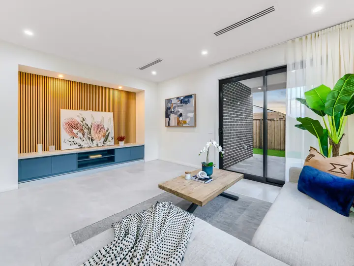 Timber-batten feature wall with a floating TV unit, in a family home Oakview built in Clyde North