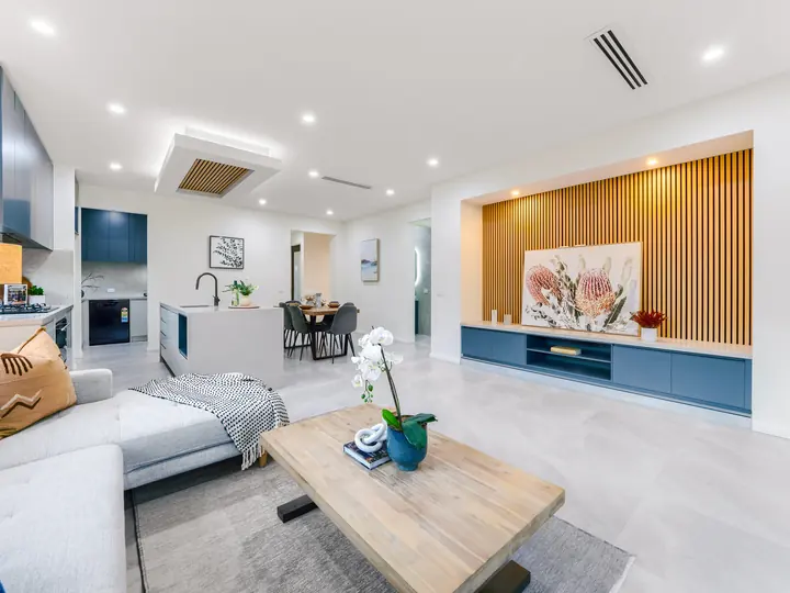 Living room with a timber-batten feature wall, in a family home Oakview built in Clyde North