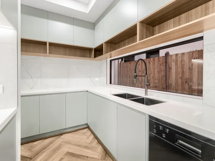 Kitchen sink under a window splashback, in a single-storey home Oakview built in Clyde North