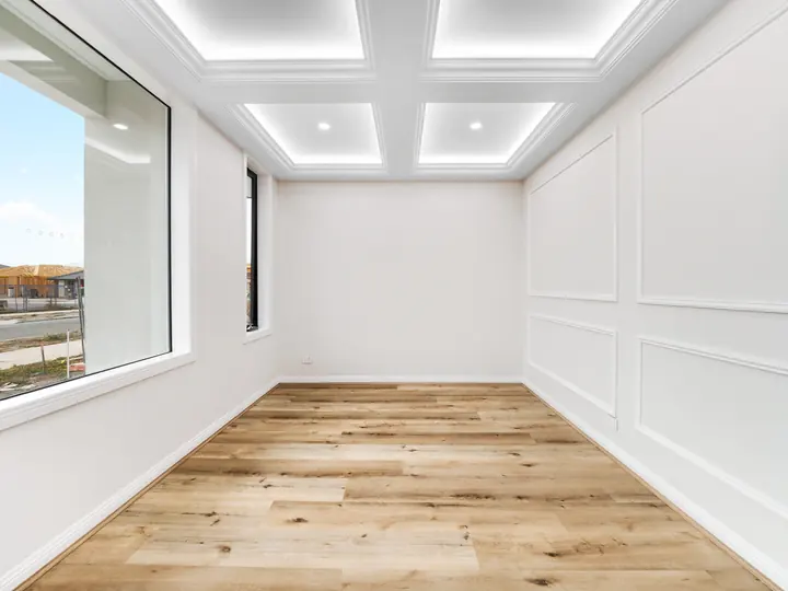 Coffered ceiling with LED strips, in a custom home Oakview finished in brushed gold fittings