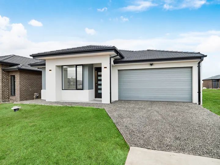 Rendered facade with a black front door and a double garage, in a custom home Oakview finished in brushed gold fittings