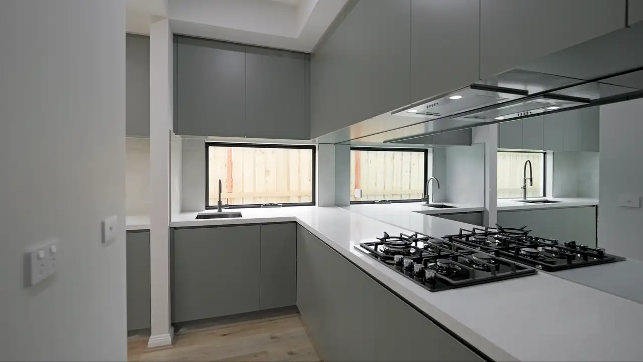 Walkthrough of a gold-finish kitchen built by Oakview Homes