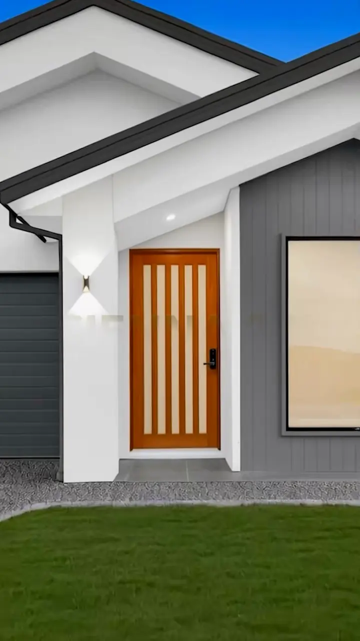Double-gable facade with grey cladding and a timber door, in the Sienna 23 by Oakview Homes