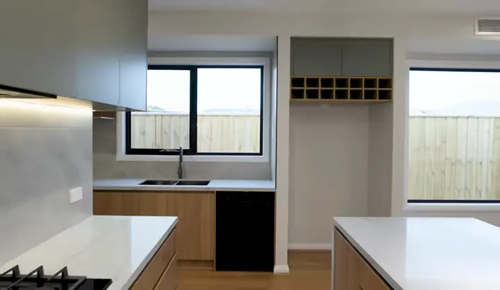Kitchen with a window splashback, in the Sienna 23 by Oakview Homes