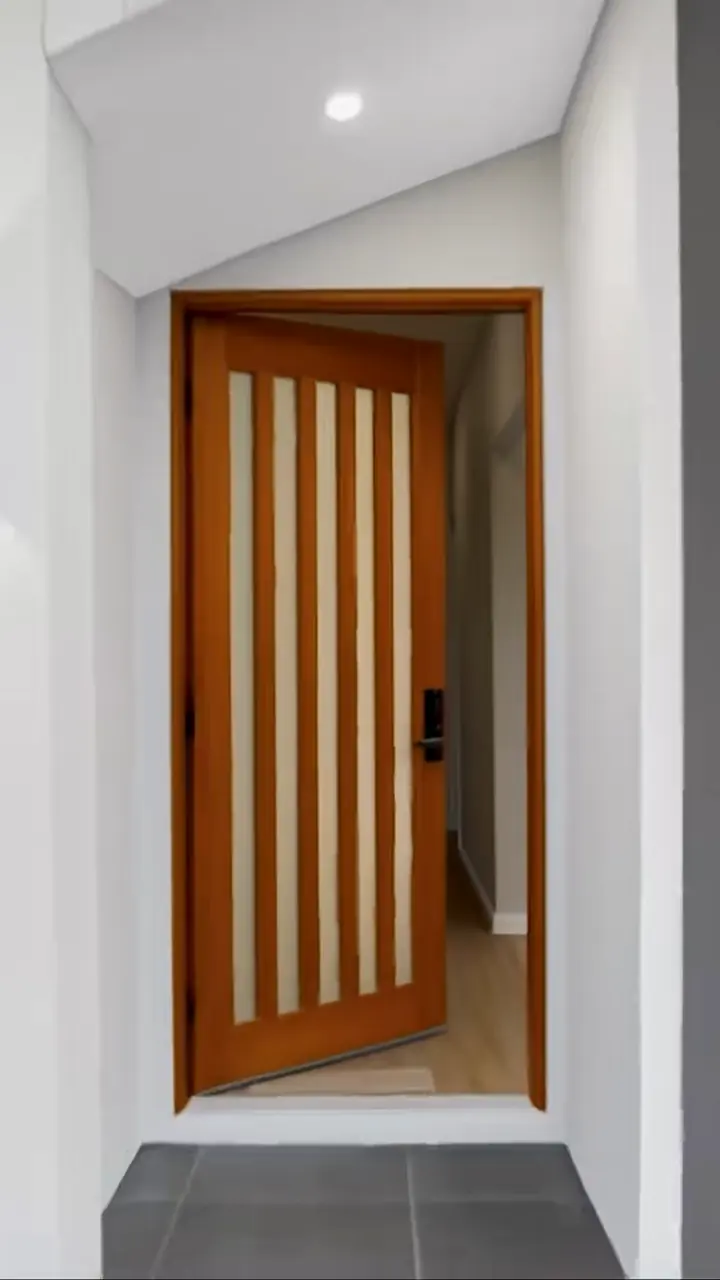 Timber entry door opening to the hall, in the Sienna 23 by Oakview Homes